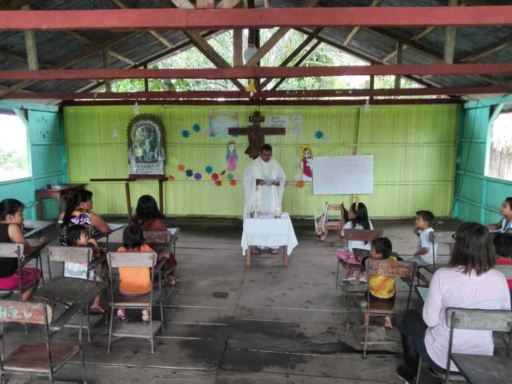 A Simple Church and Fr. Enrique Celebrating Holy Mass